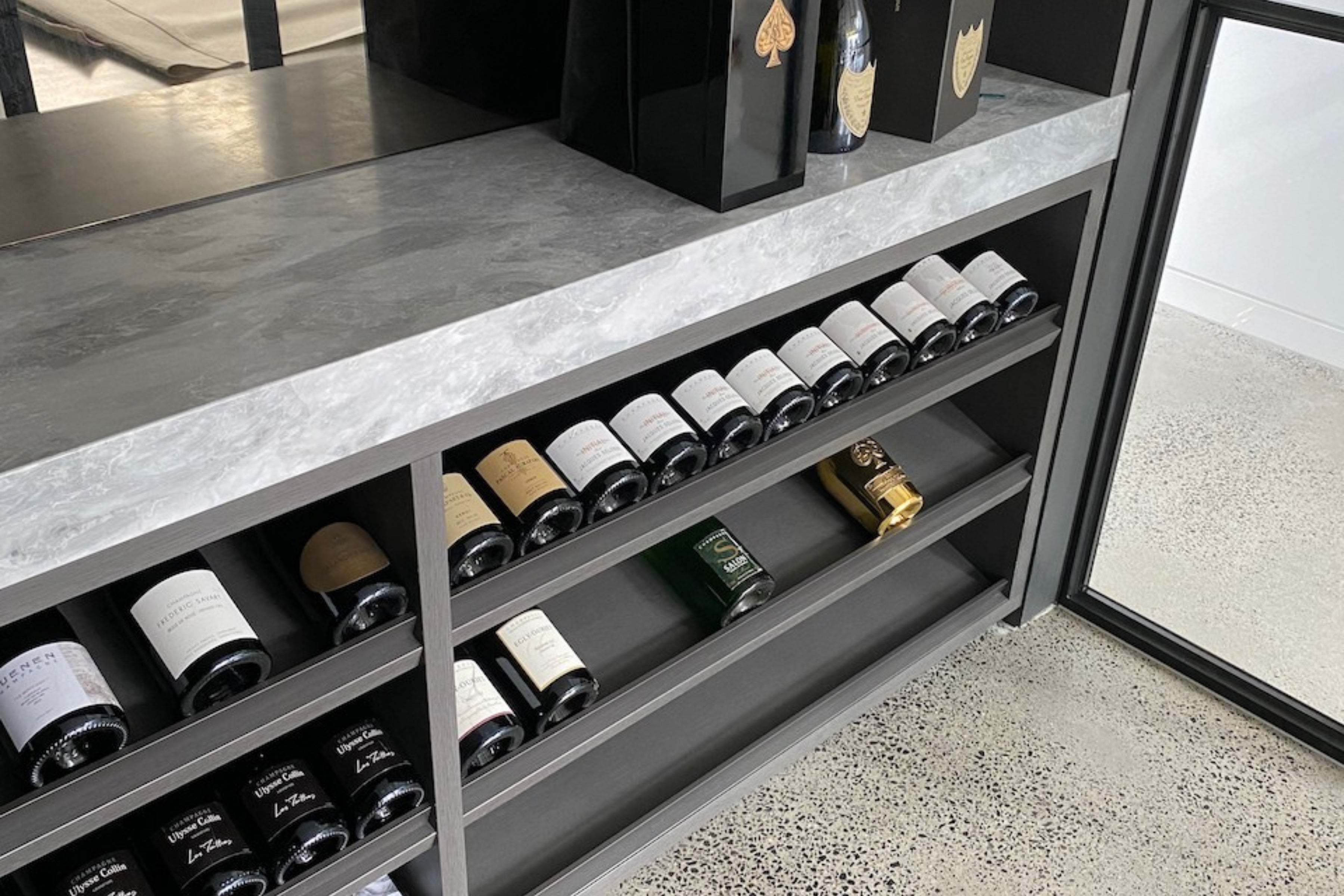 Rail for wine shelf